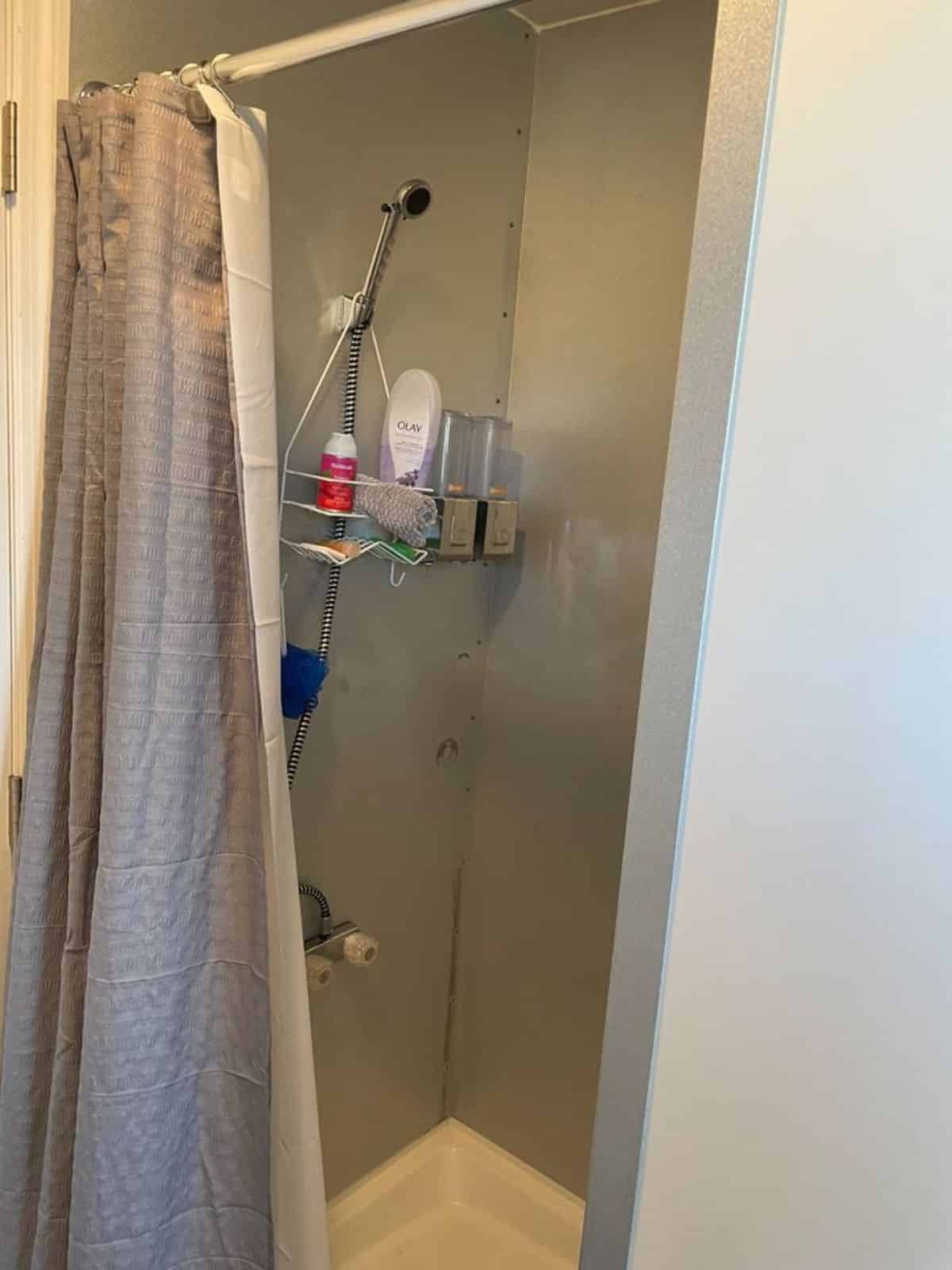 separate shower area in bathroom of tiny home on wheels