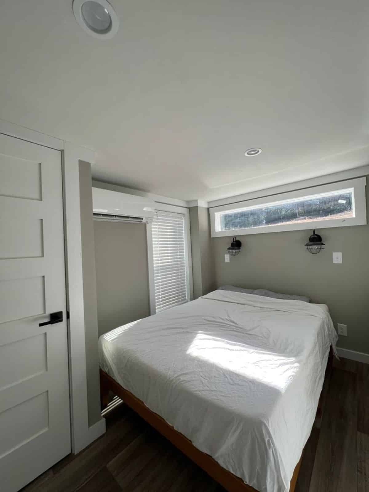 bedroom of park model tiny home has a comfortable bed