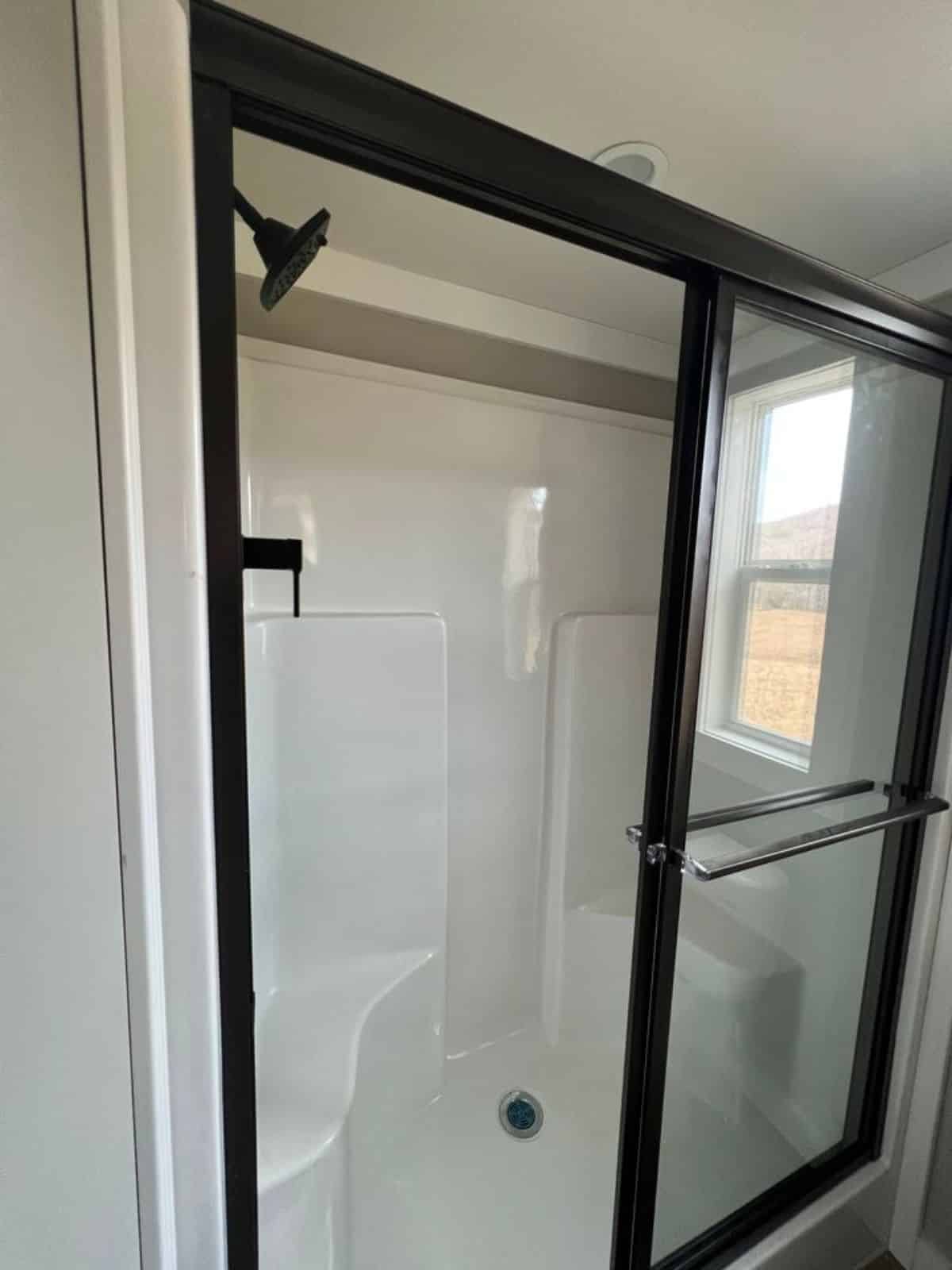 separate shower area with glass enclosure