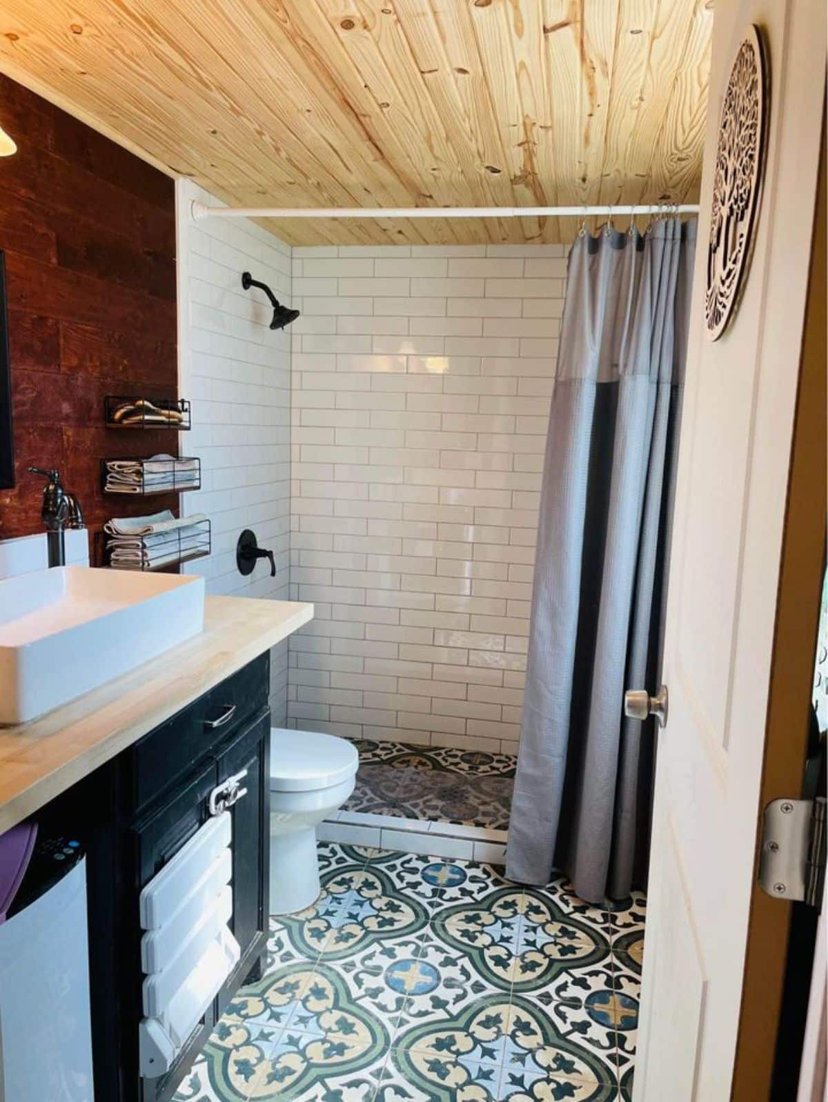 separate shower area in bathroom of affordable 3 bedroom tiny house