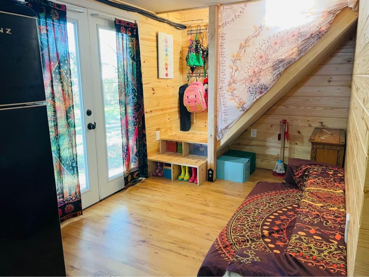 living area and wooden interiors of affordable 3 bedroom tiny house