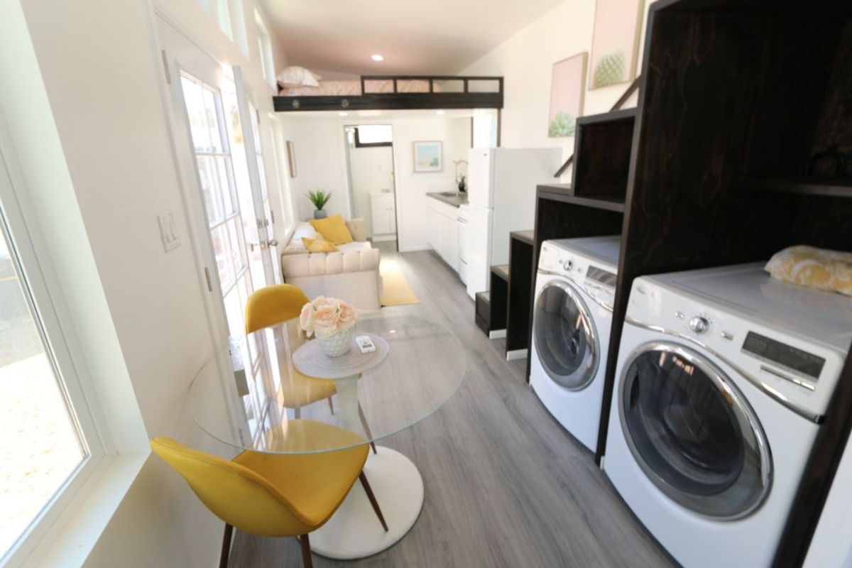 washer dryer combo accommodated under the stairs and small dining table  is included in the deal
