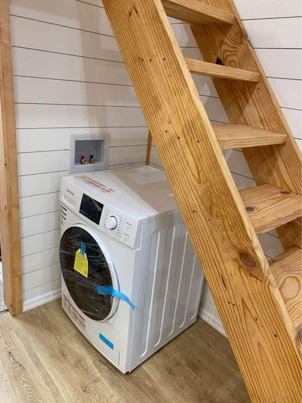 washer dryer combo under the stairs is also included in the deal