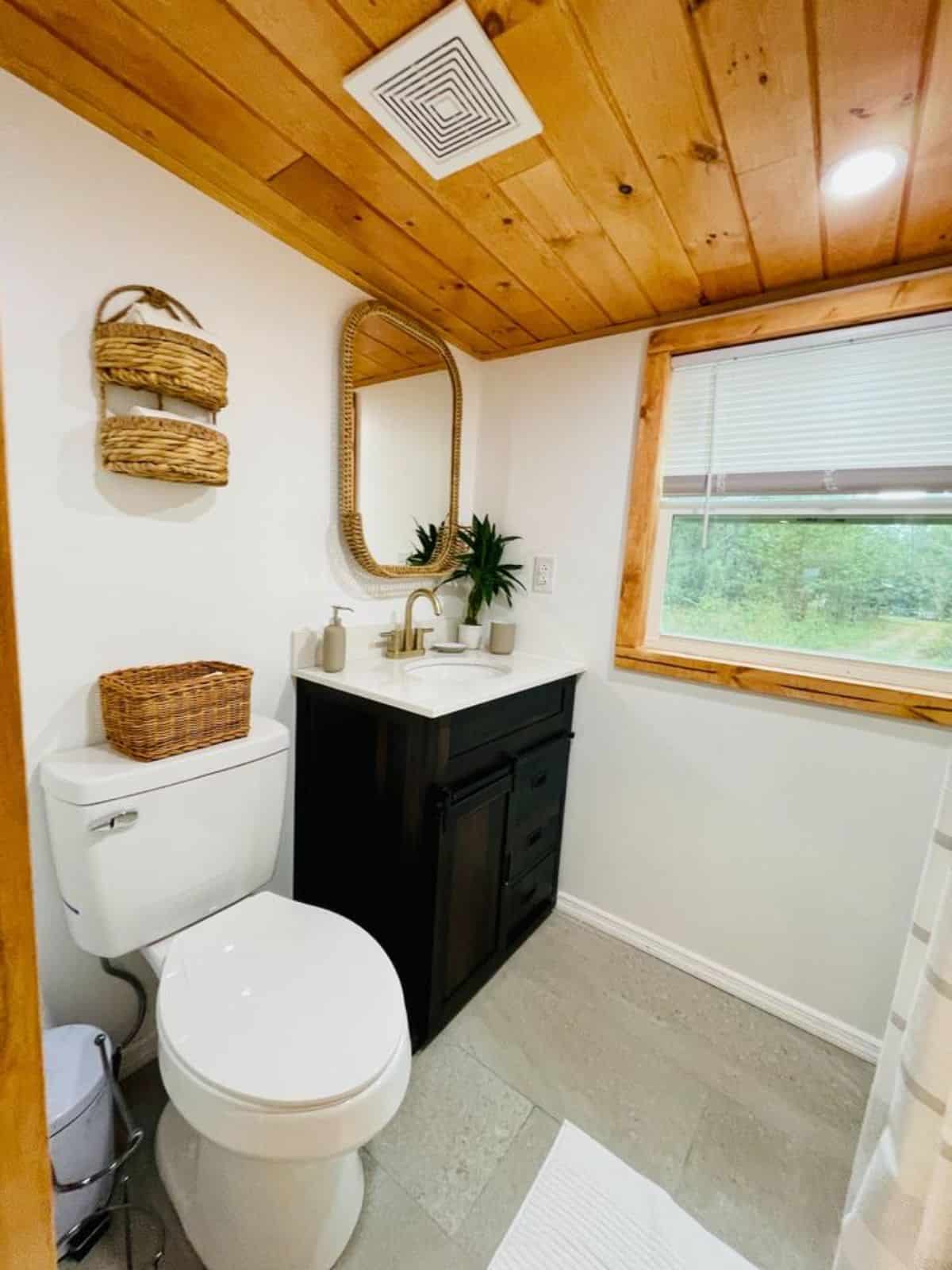 standard toilet and extra space in bathroom of brand new tiny house