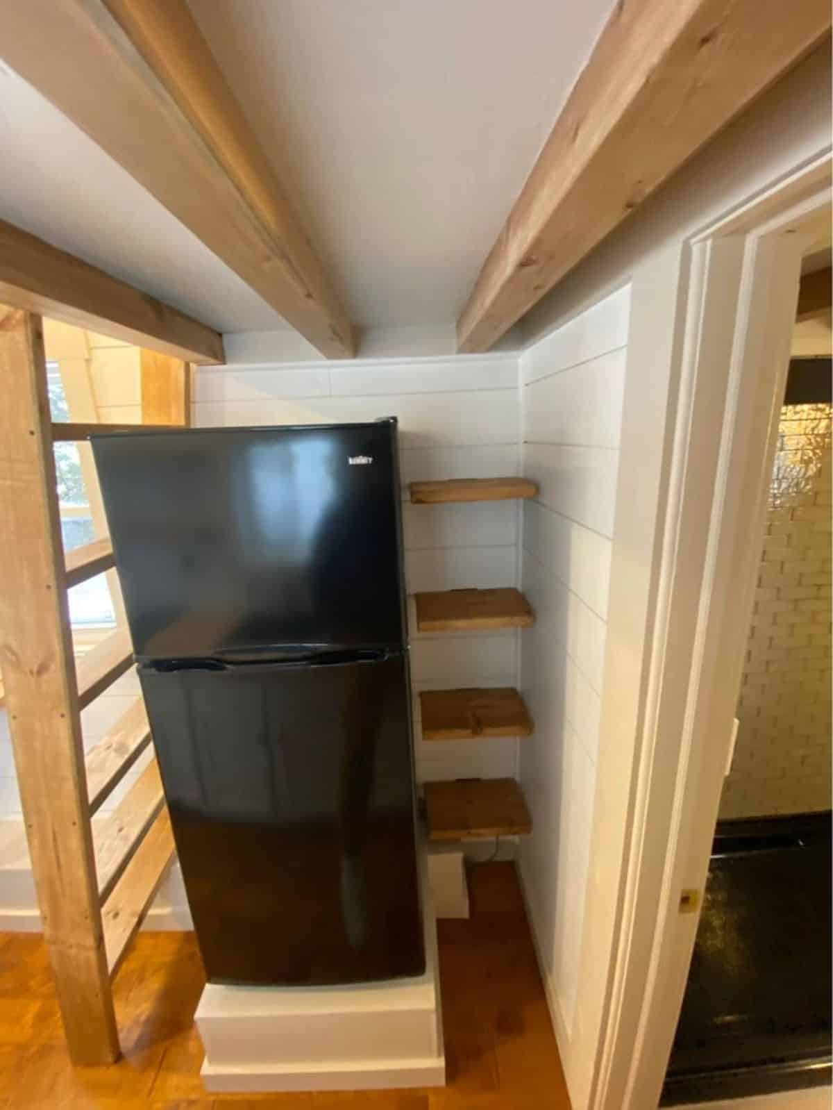separate space for double door refrigerator and small racks for pantry things