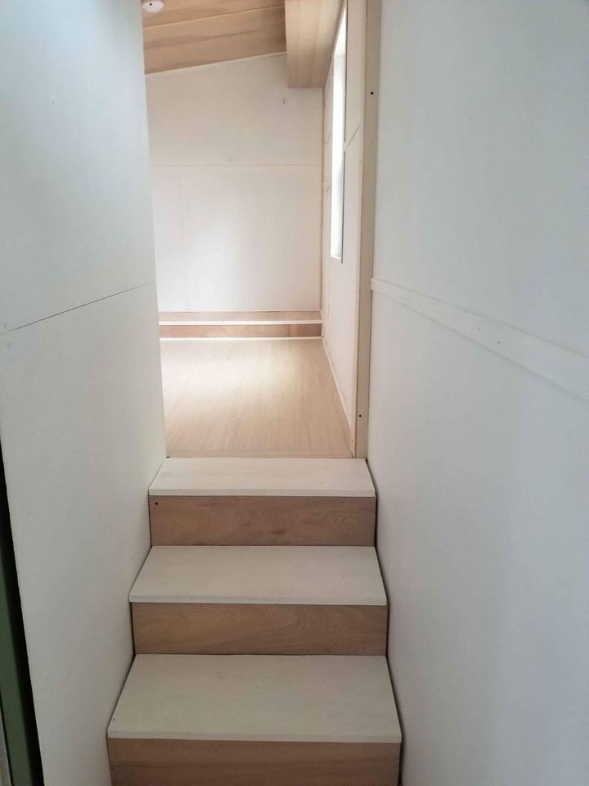 stairs leading to the bedroom area of non toxic tiny home