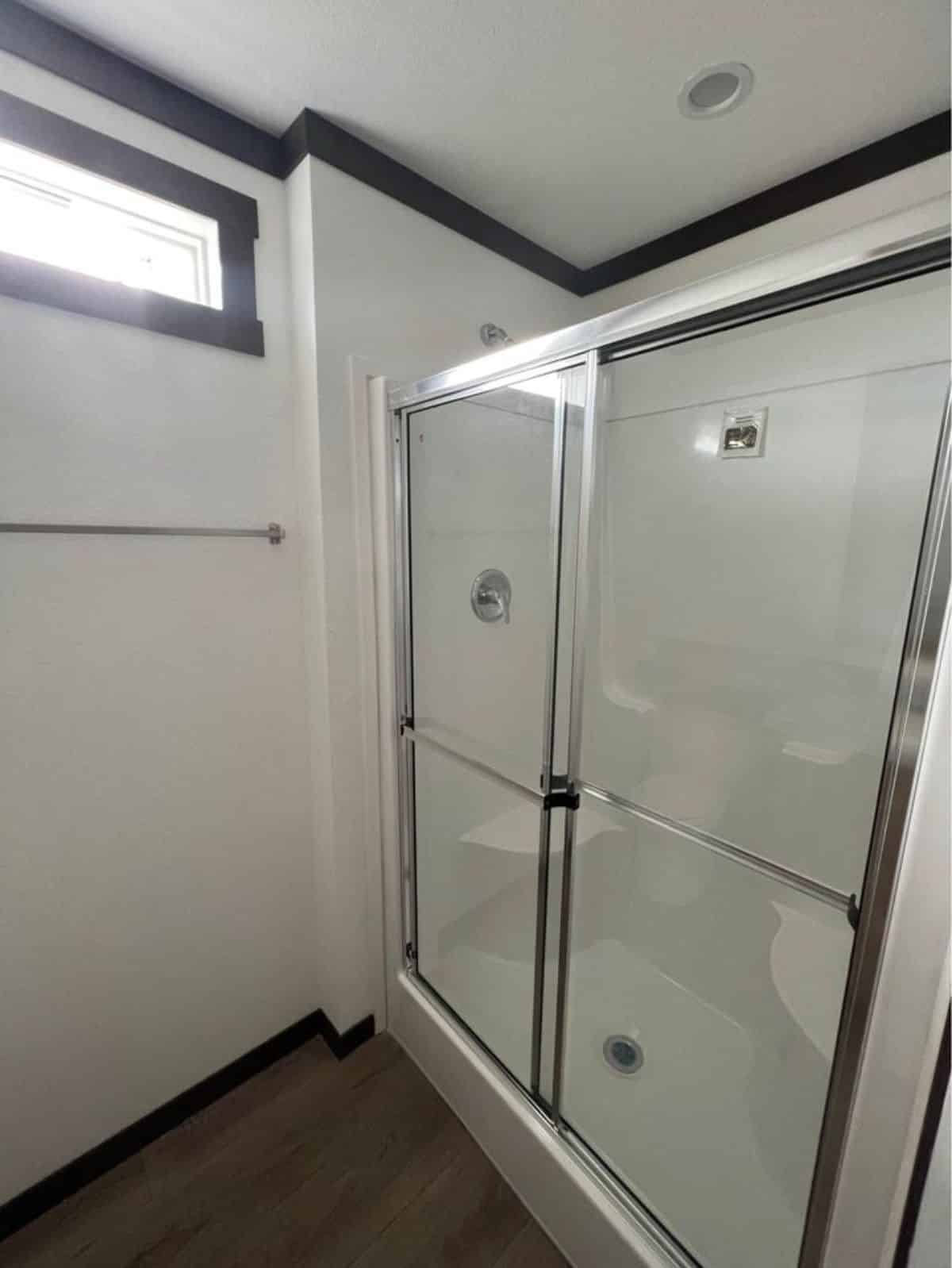 separate shower area in bathroom of one bedroom tiny home