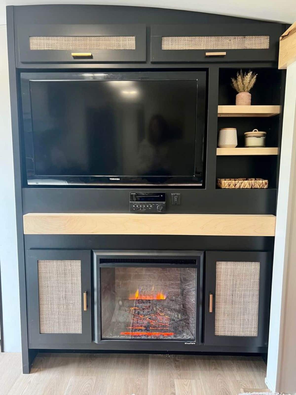 Customized entertainment unit with TV set and fireplace