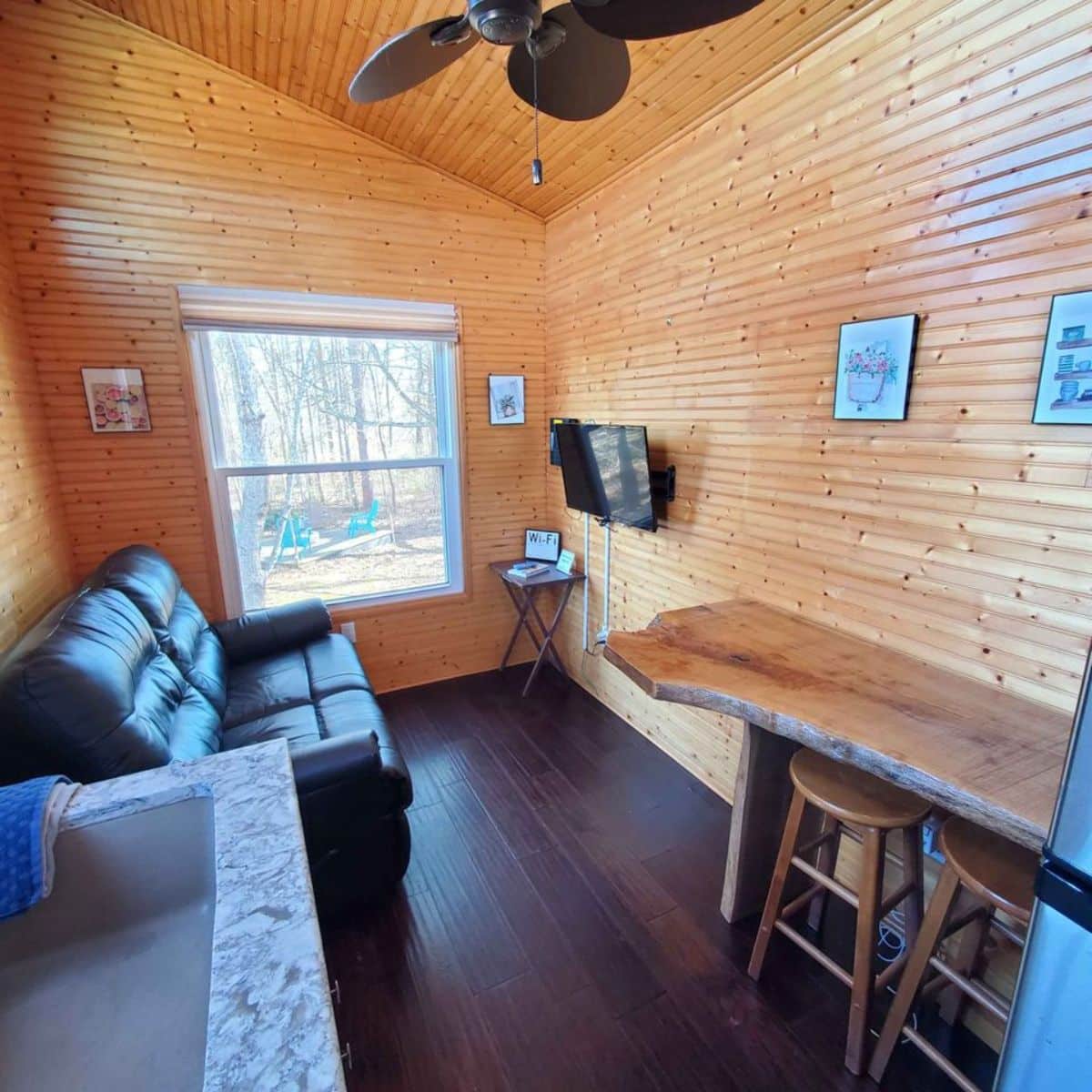 living area of tiny home with downstairs bedroom