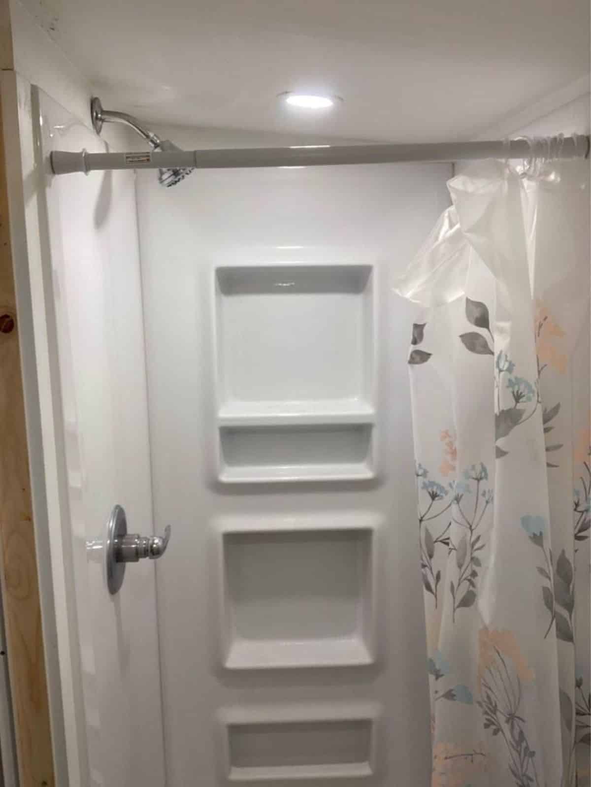 full length shower area in bathroom of micro cabin house