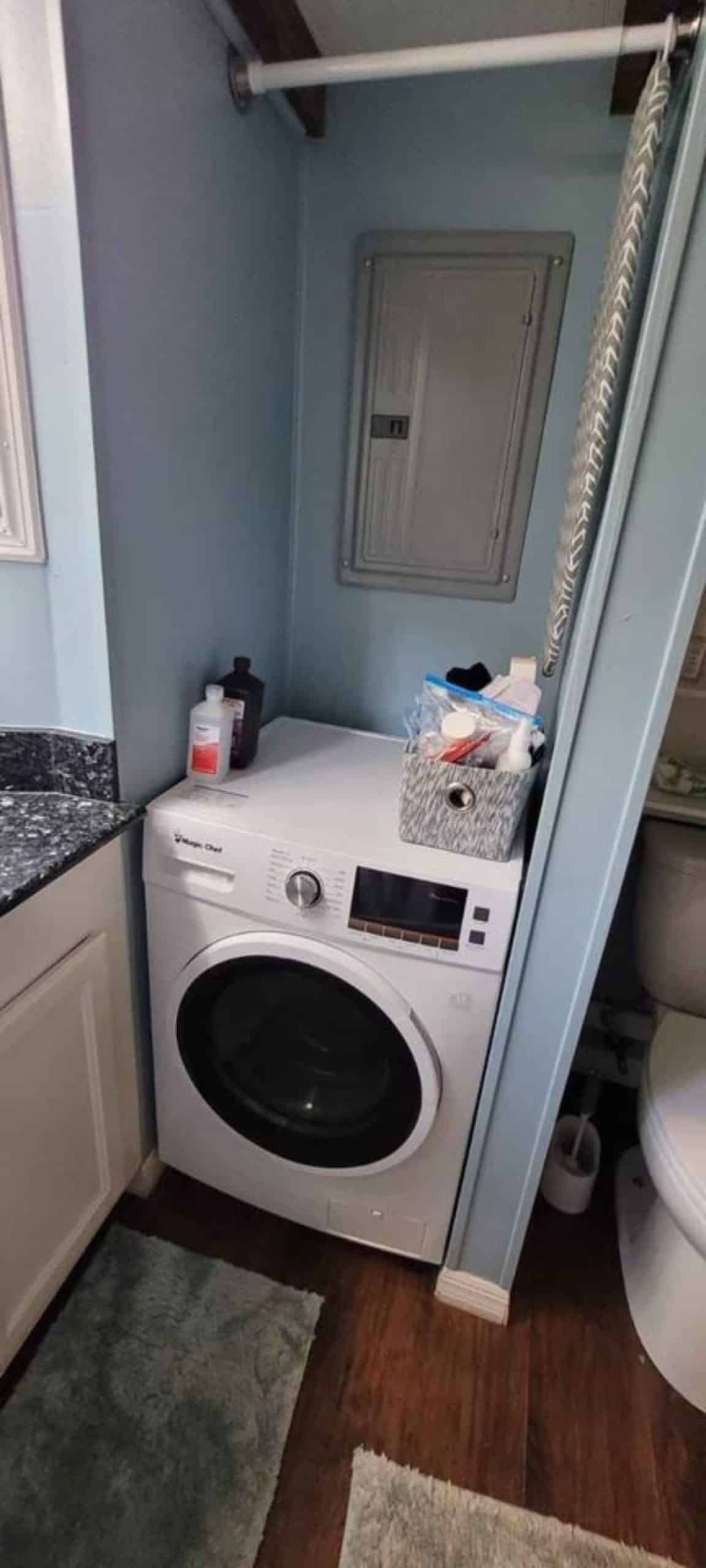 washer dryer combo included in the bathroom of the house