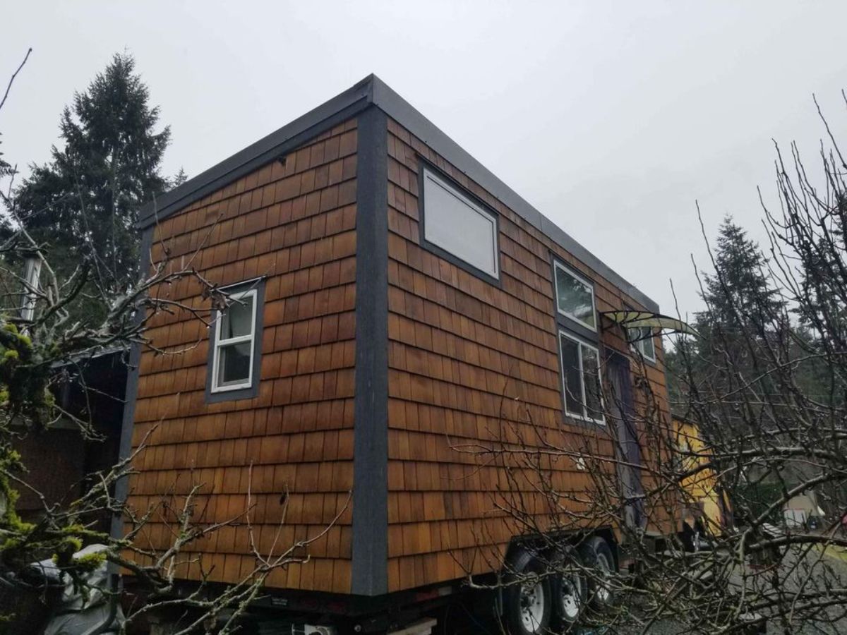 24' tiny home in British Columbia under woods