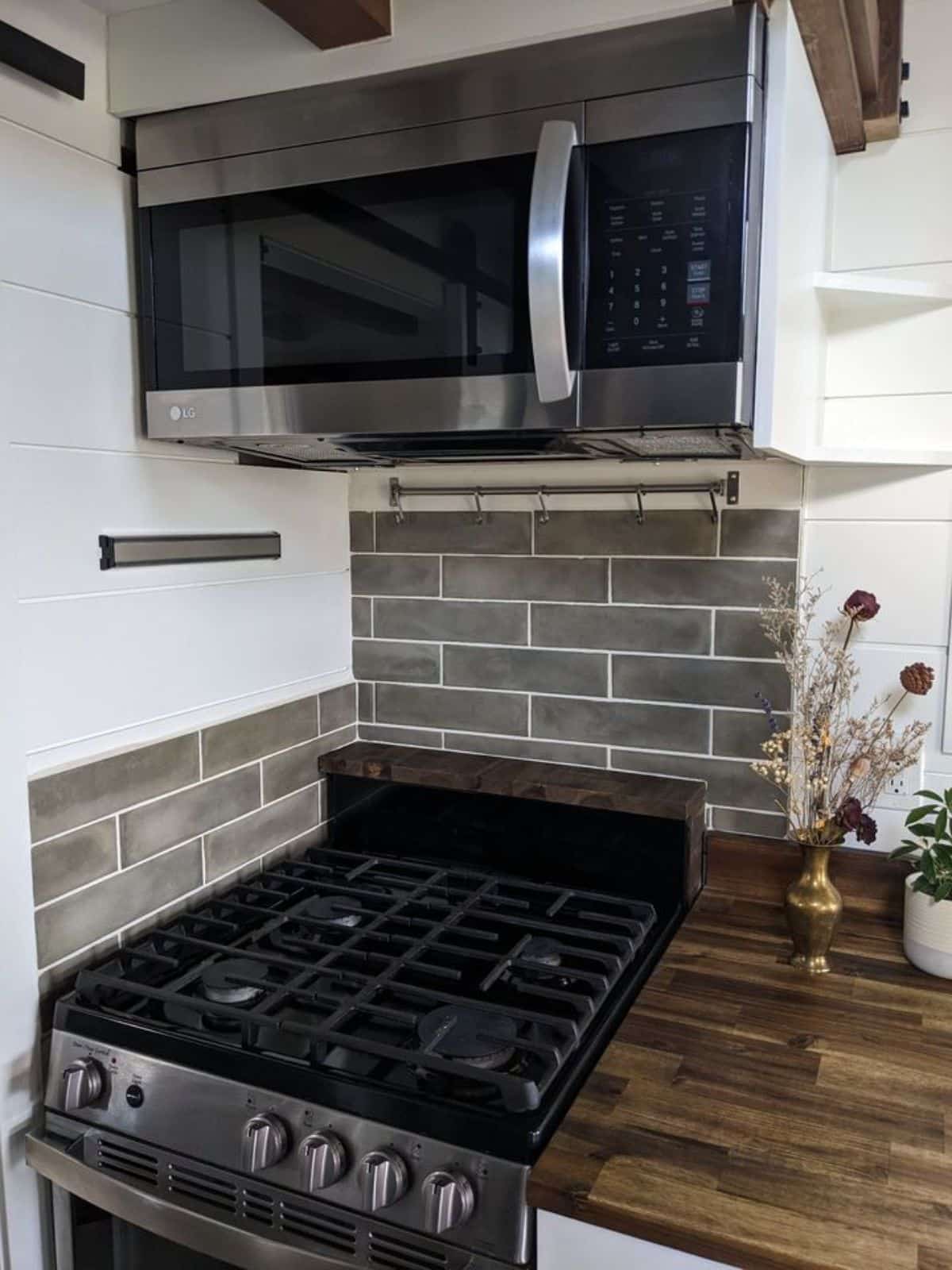 propane stove and oven, dishwasher present in the kitchen area