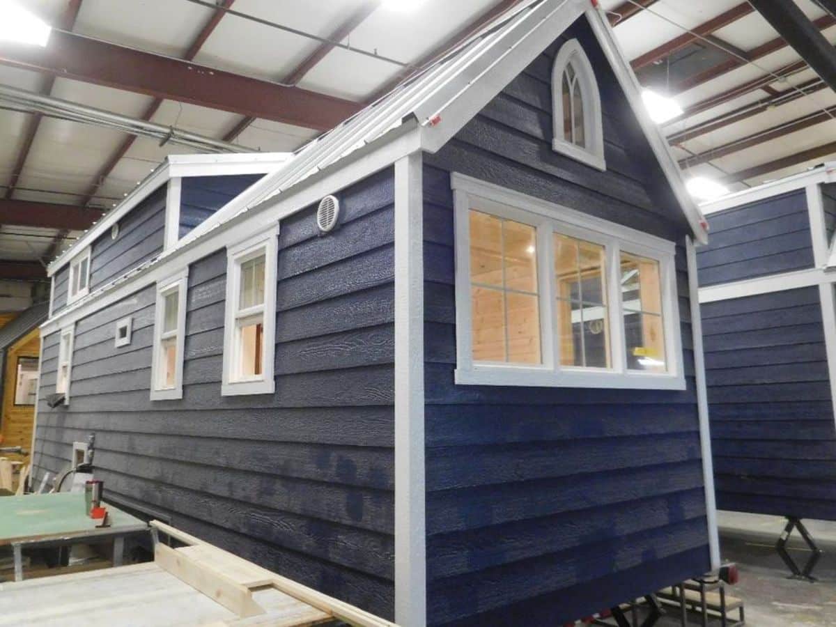stunning blue and white exterior of 25' RVIA certified tiny home