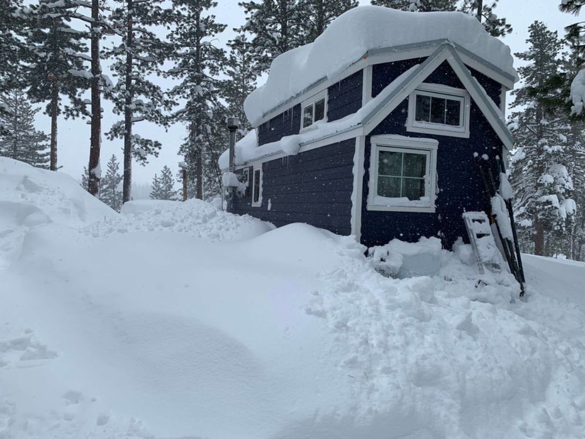 25' RVIA certified tiny home covered under snow