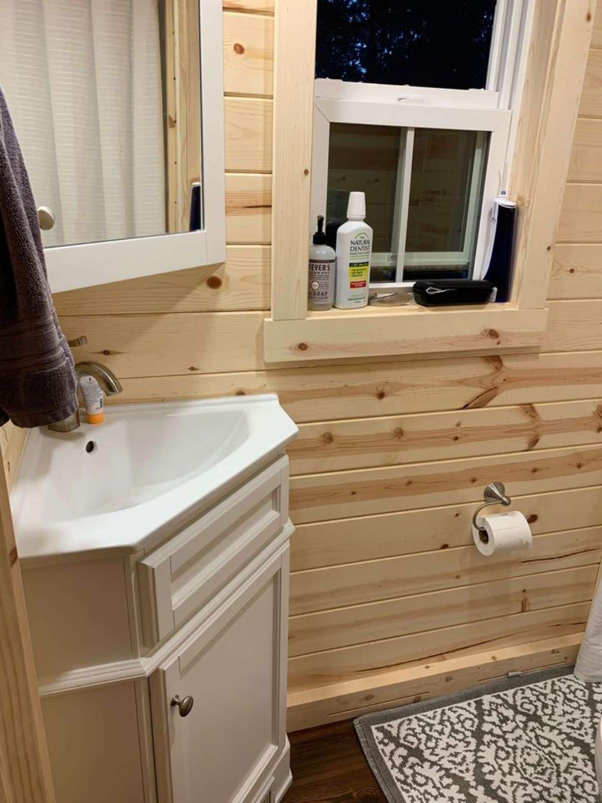 sink with vanity installed in bathroom of 25' RVIA certified tiny home