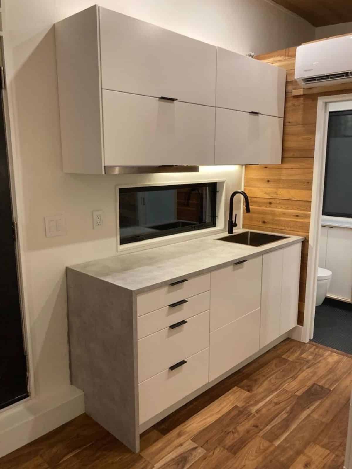 stylish and well organized kitchen area of 27’ tiny house in Dallas