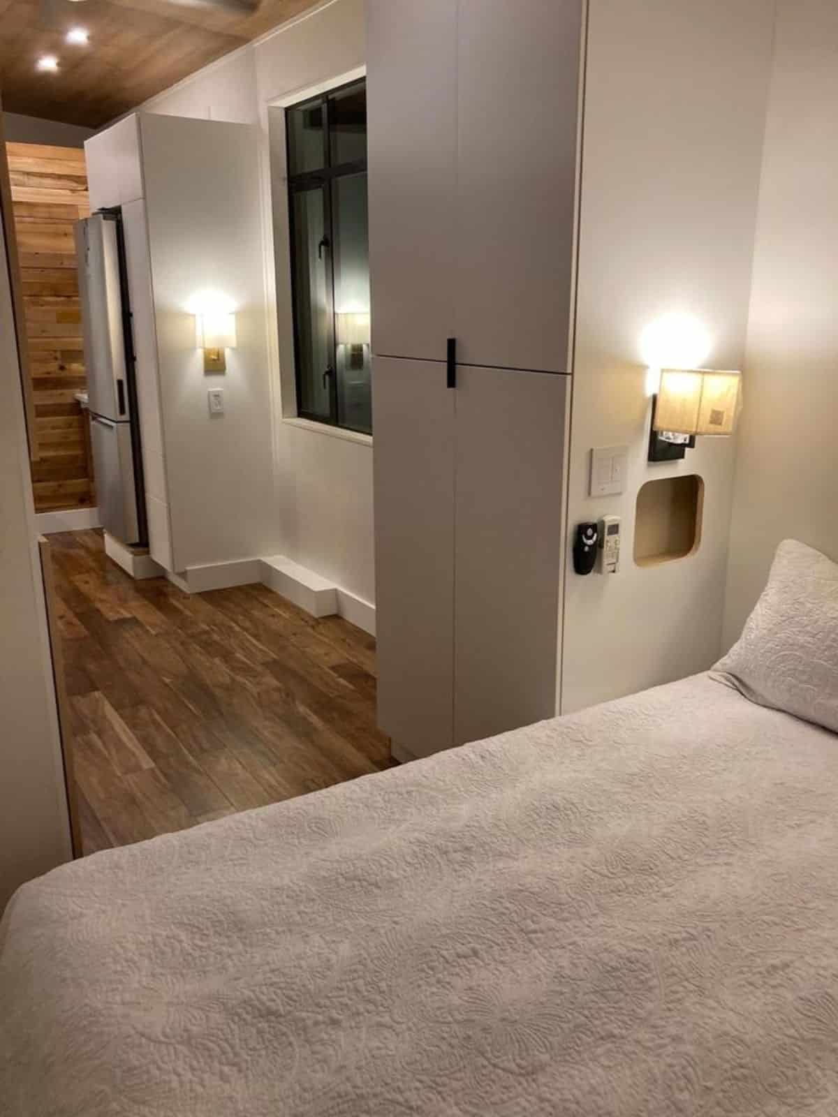 huge wardrobe at the entrance of the bedroom of 27’ tiny house in Dallas