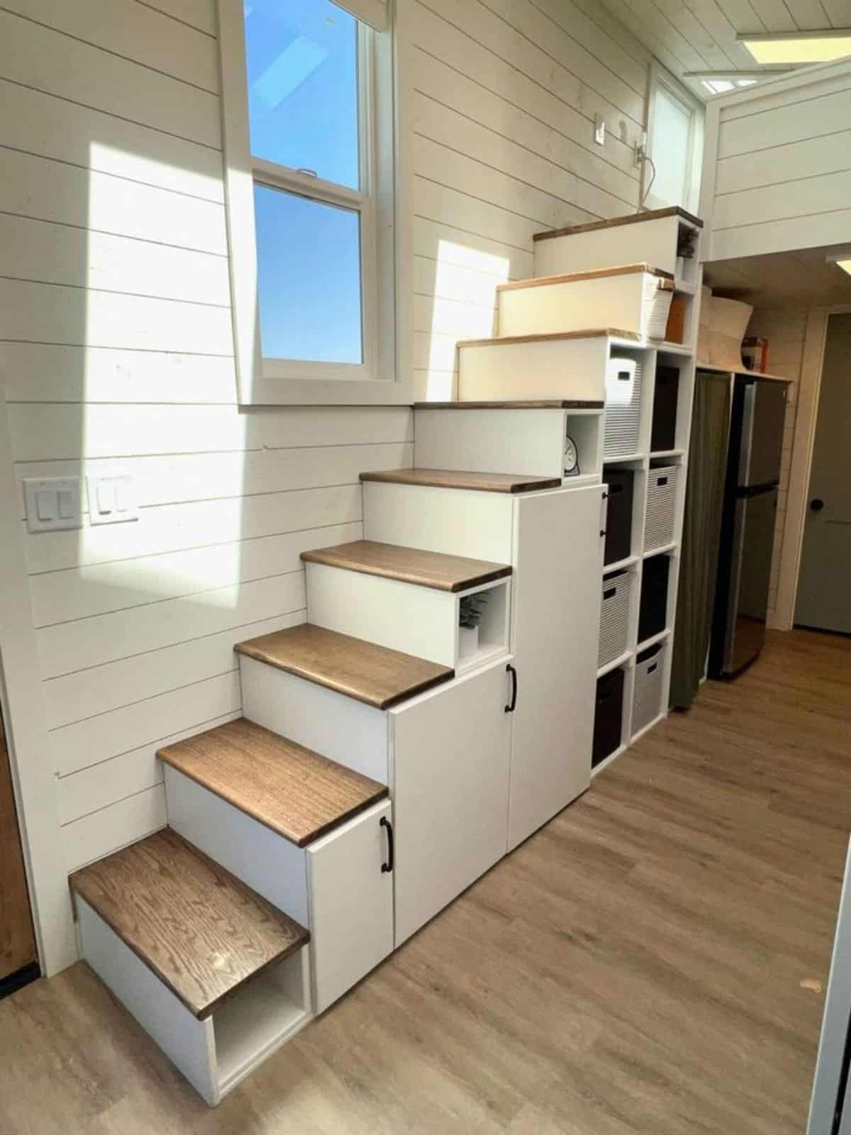 multi purpose stairs leading to the loft bedroom of 28' luxury tiny home
