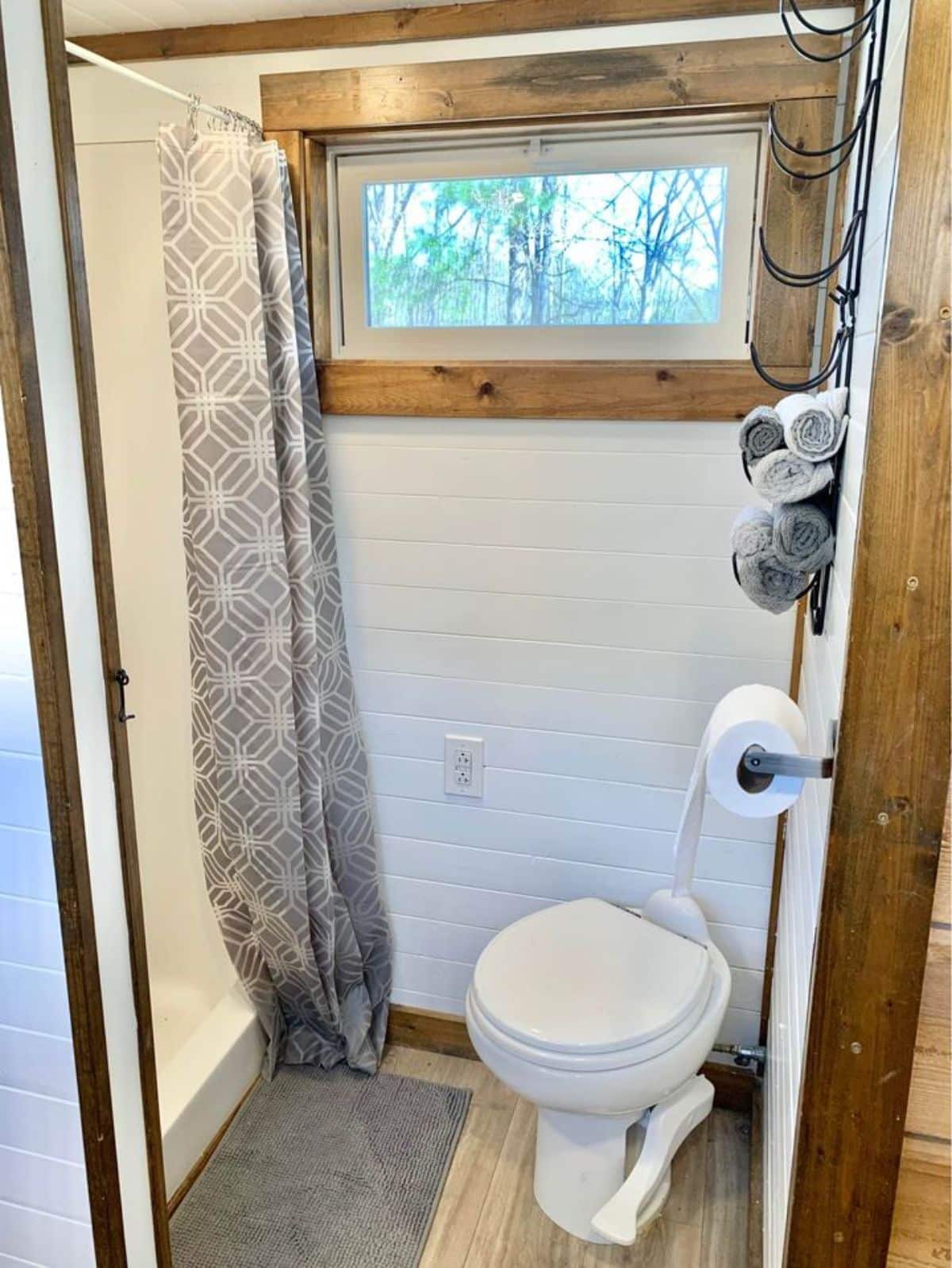 standard toilet in bathroom of 28’ NOAH certified tiny home