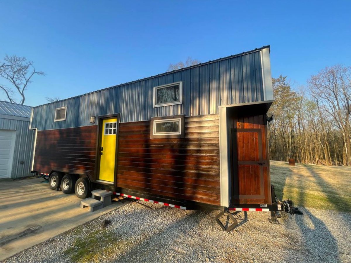 main entrance and wooden exterior of 28’ NOAH certified tiny home