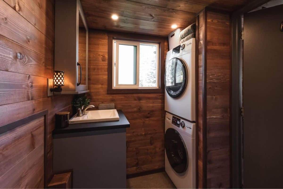 washer/ dryer combo in included in the bathroom of 30' tiny house on wheels
