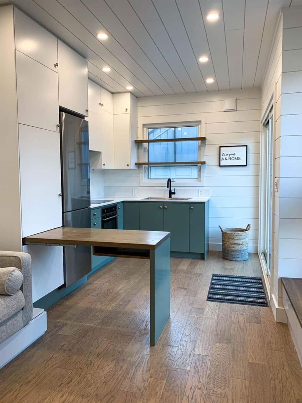 kitchen area of tiny home in Ontario is gorgeous with all the necessary appliances in order