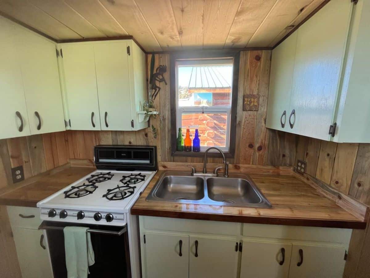 kitchen of 40' beautiful tiny home is small yet beautiful
