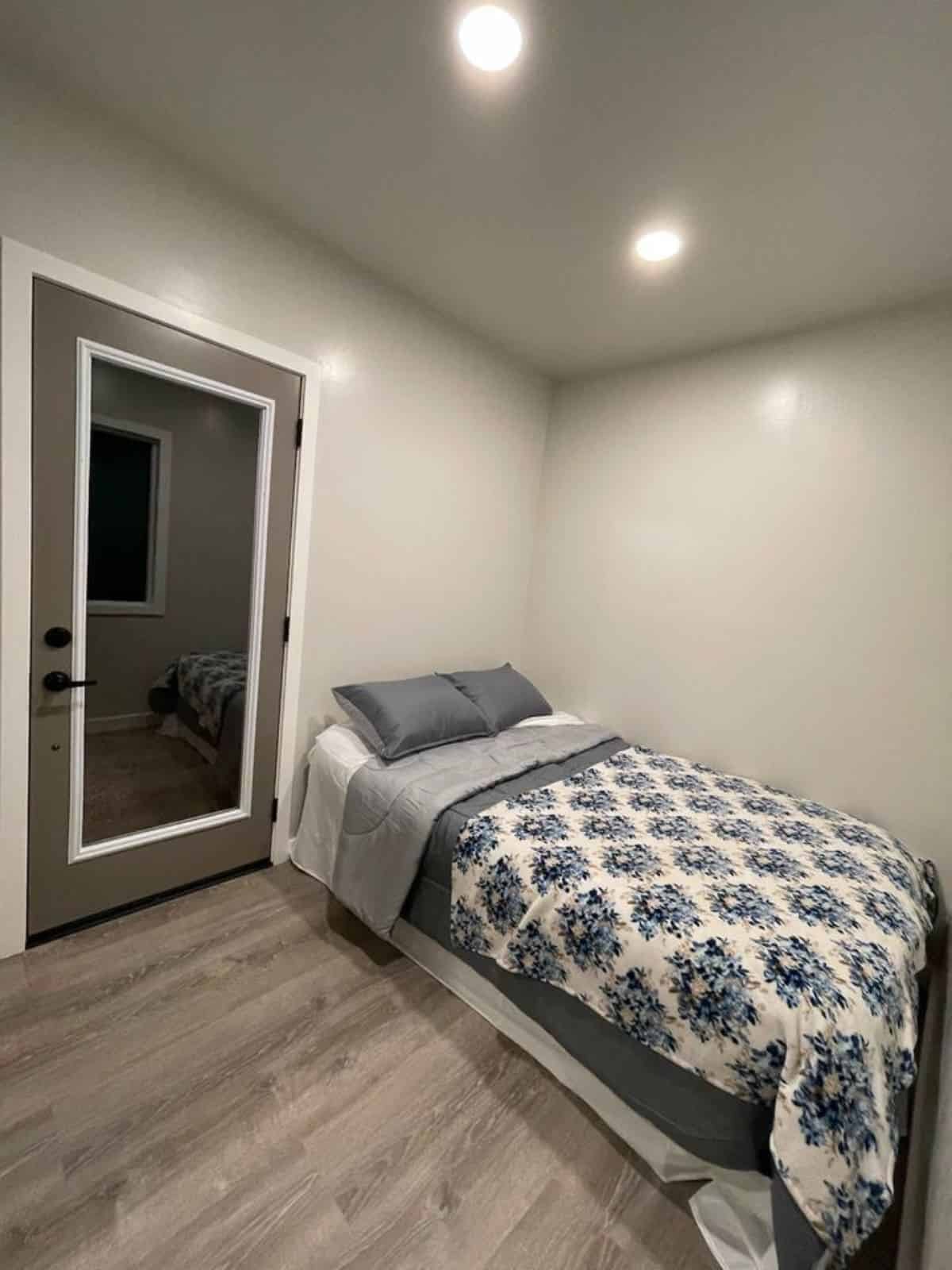 bedroom of custom container home has a comfortable bed