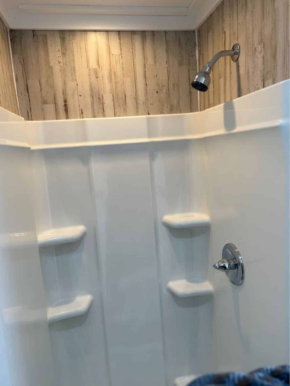 separate shower area with head shower in bathroom