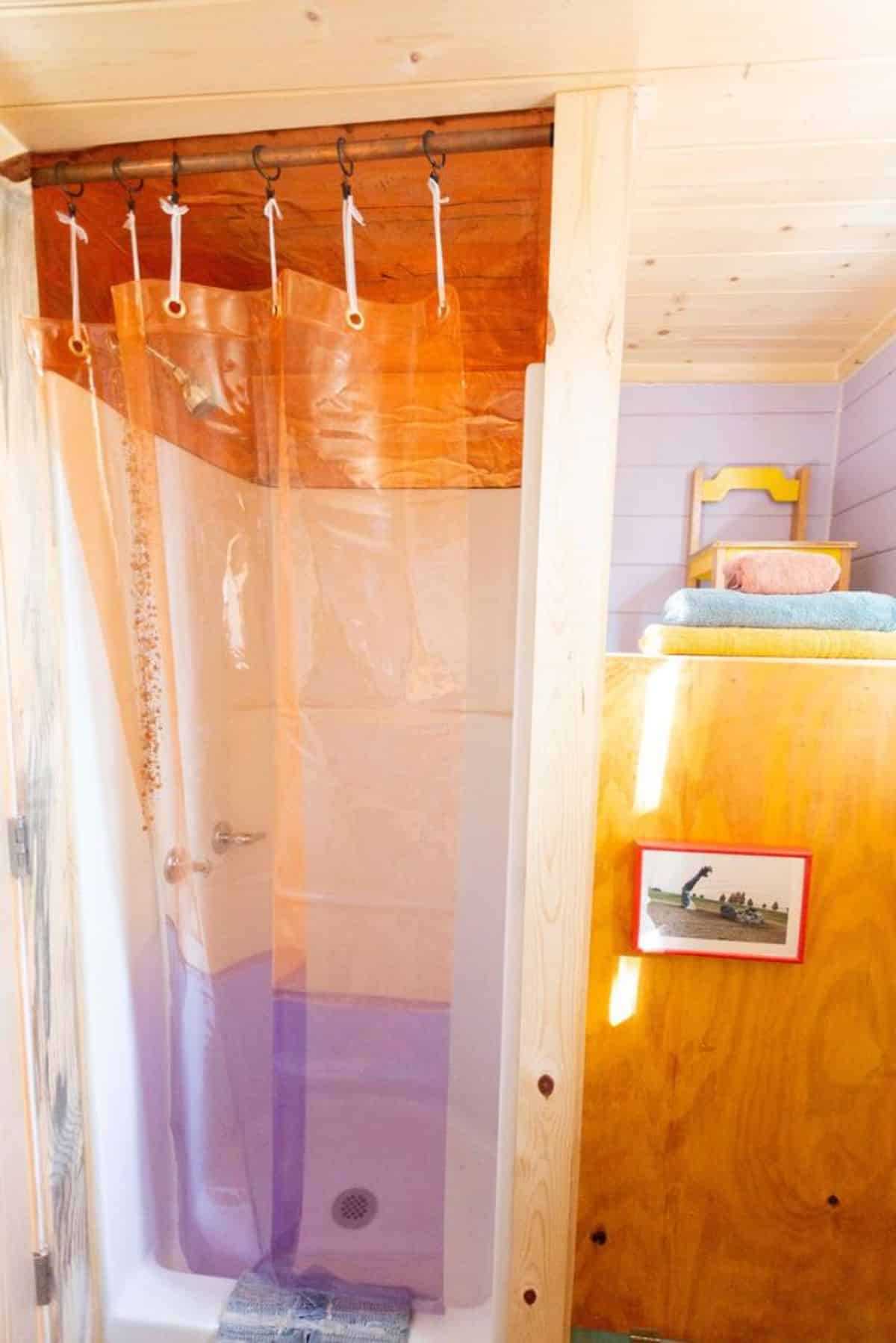 separate shower area in bathroom of mini cabin home