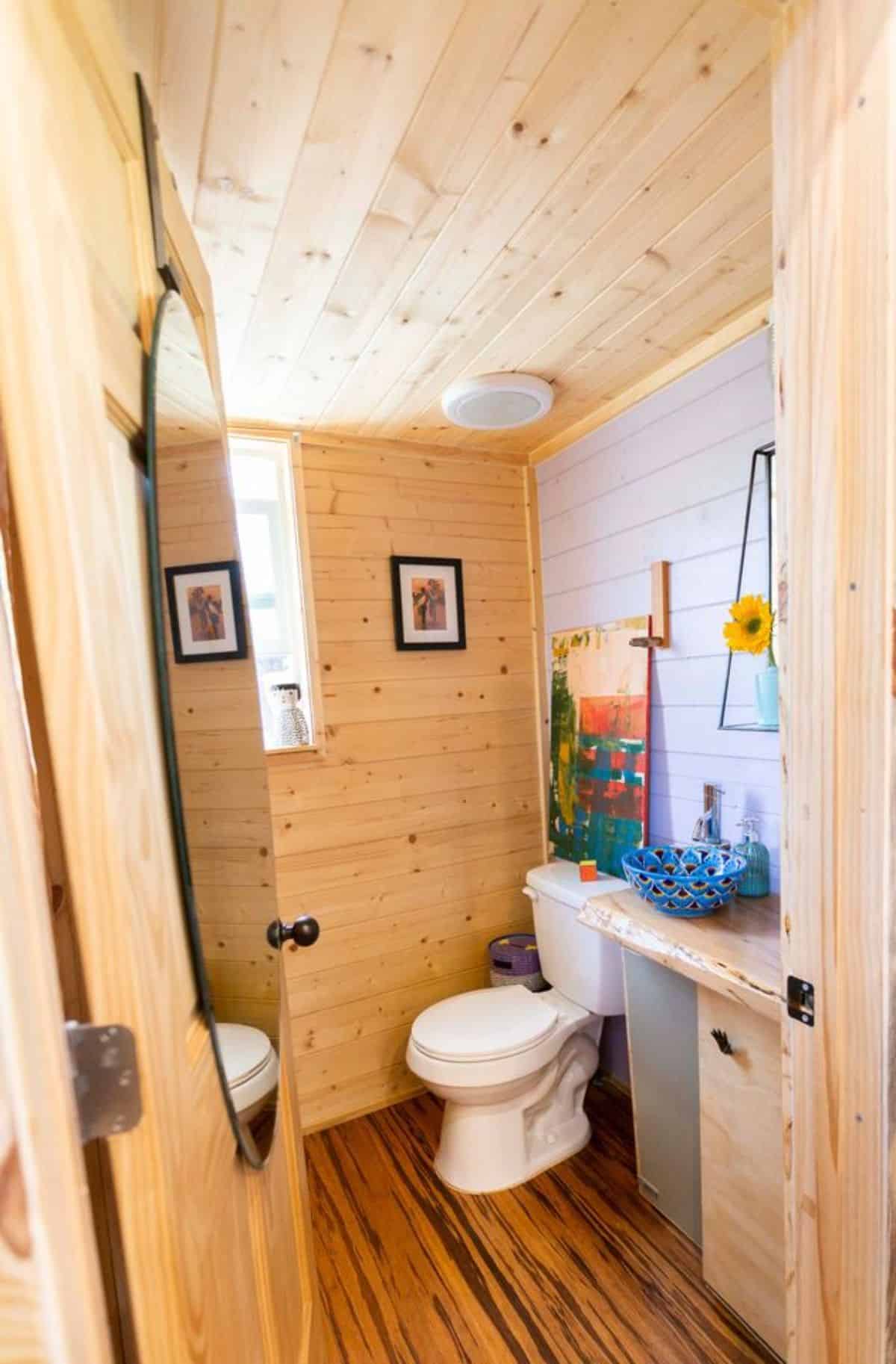 bathroom of mini cabin home has all the standard fittings