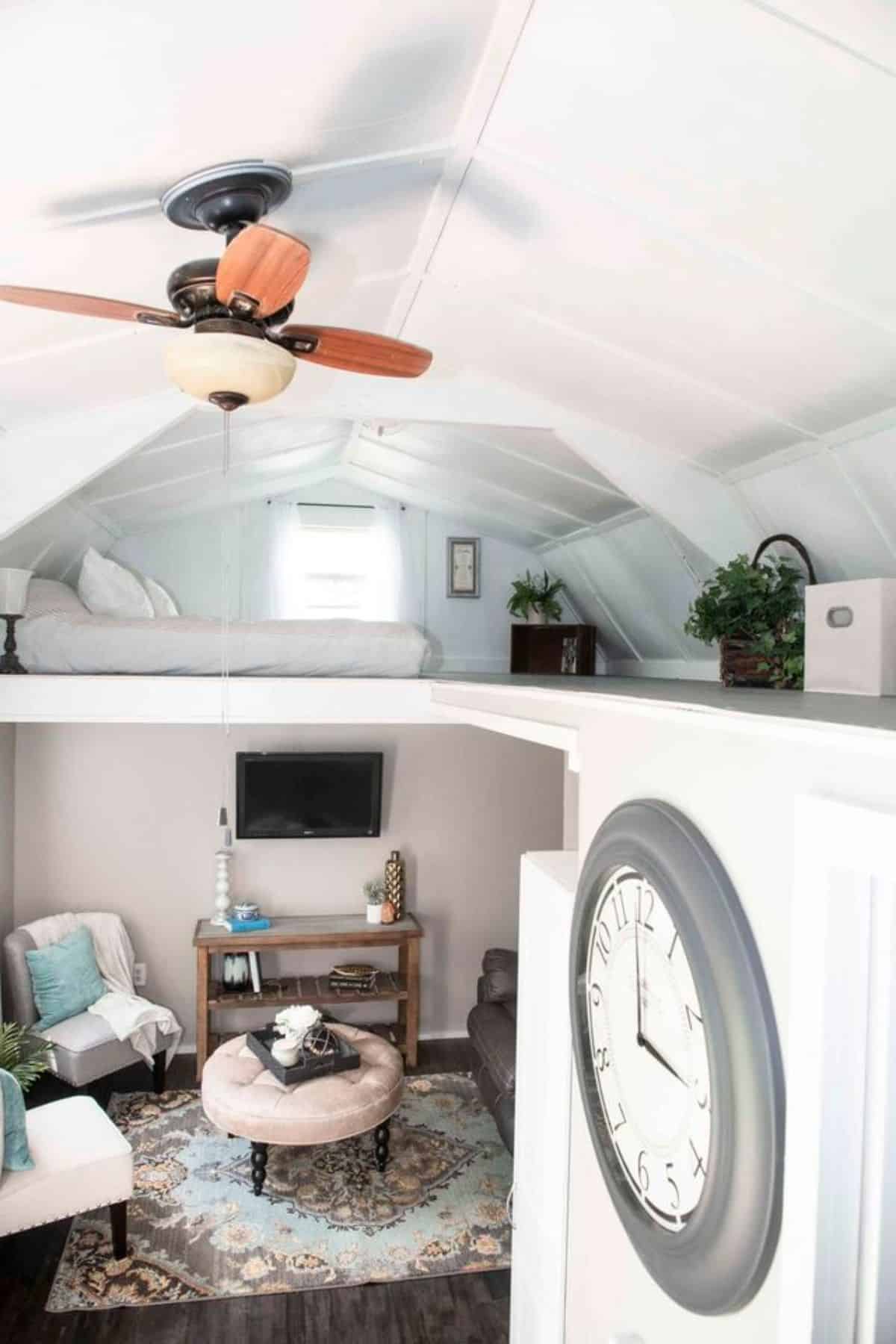 full view of living area and loft of adorable tiny home