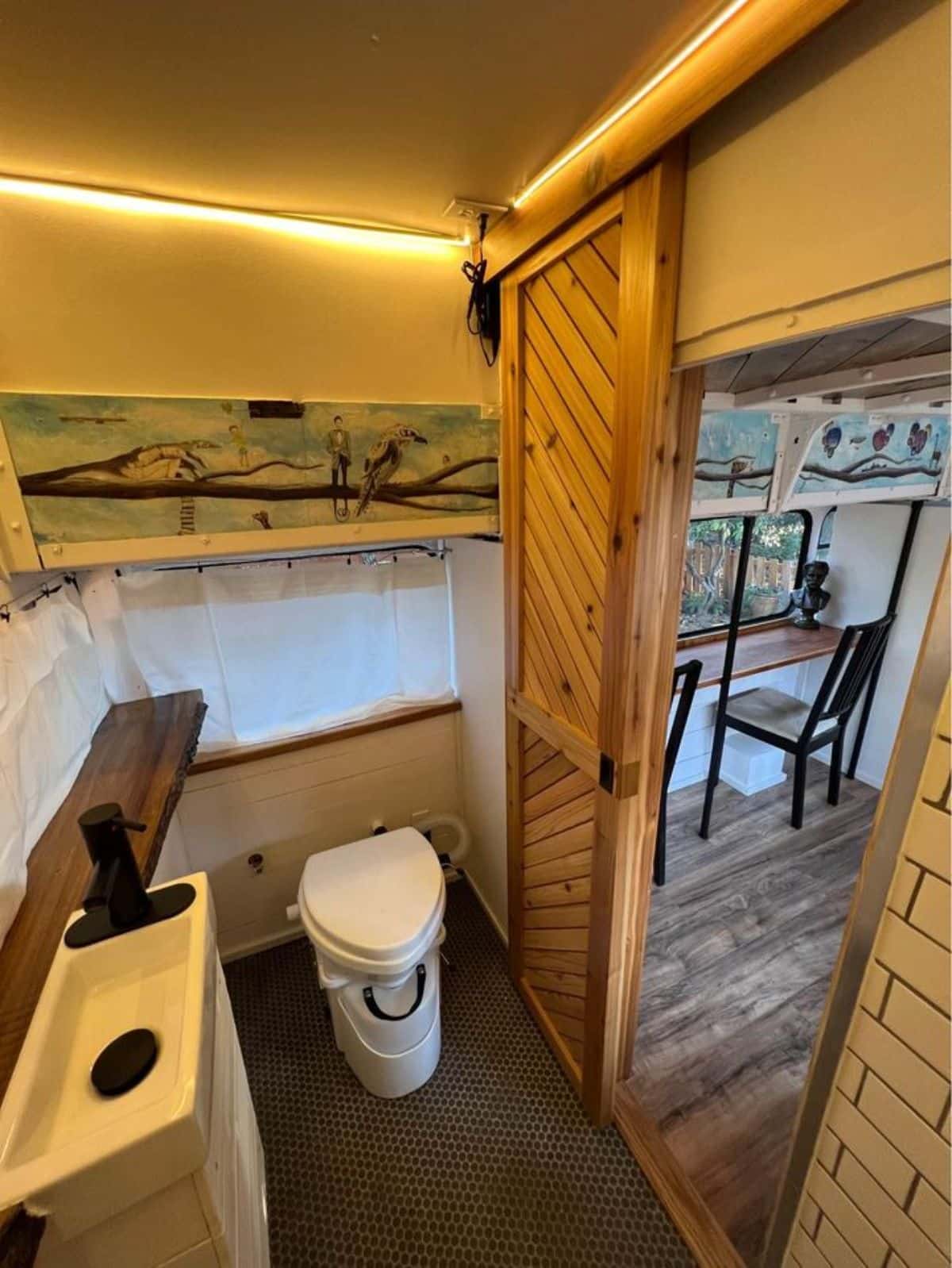 bathroom of AirBnb tiny home has all the standard fittings and composting toilet