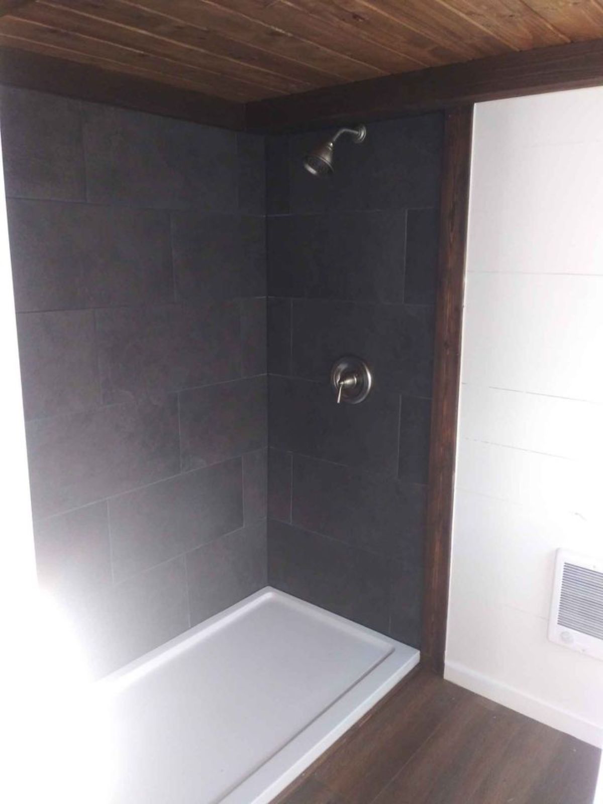 separate shower area with head shower