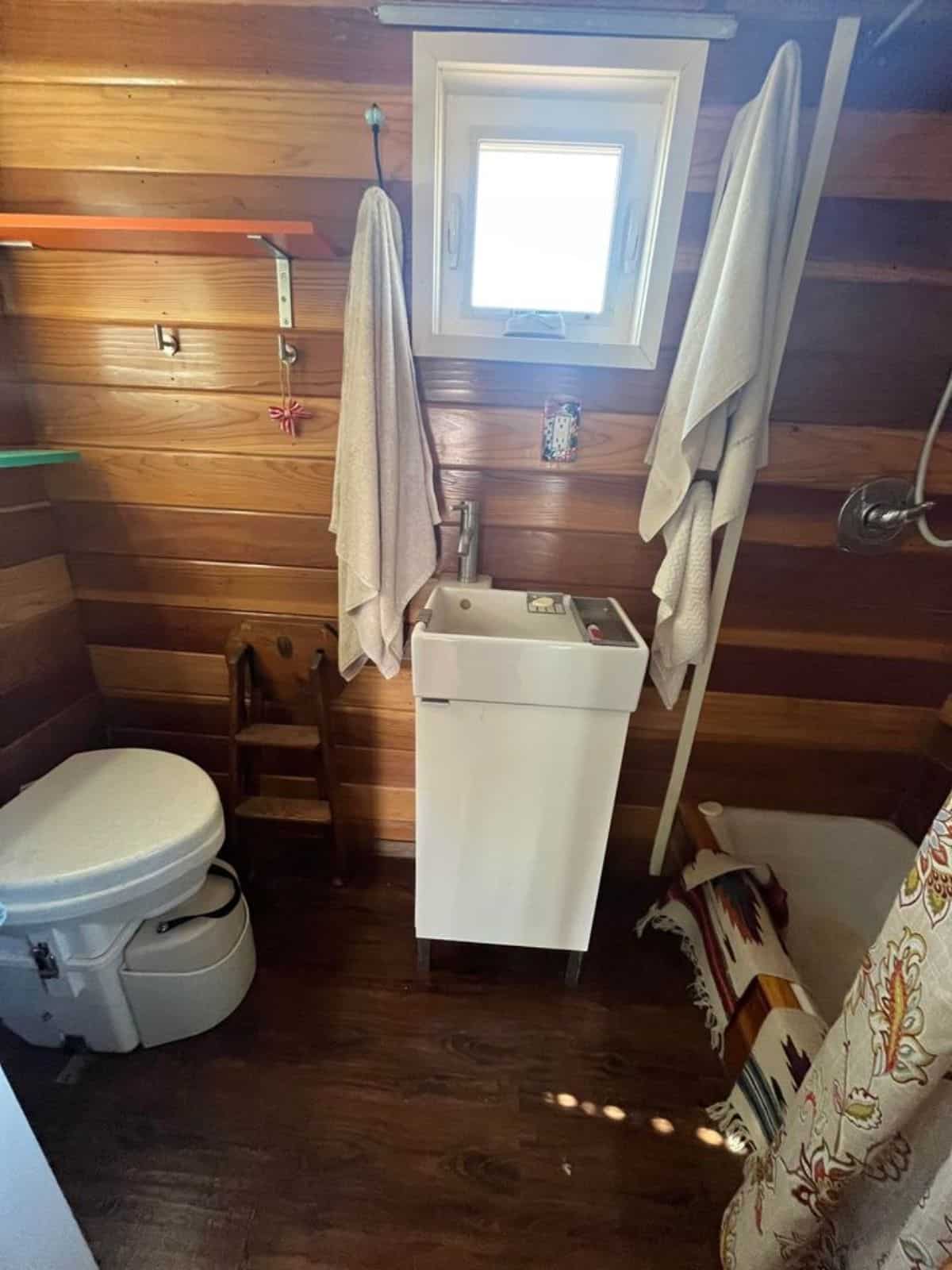 sink with vanity in bathroom of custom mobile home