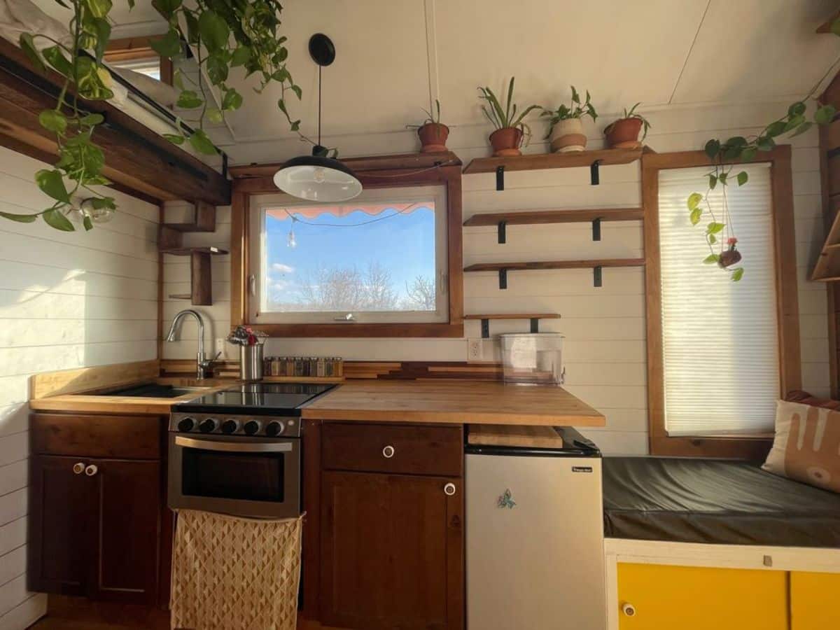 kitchen is decently sized and decorated with plants