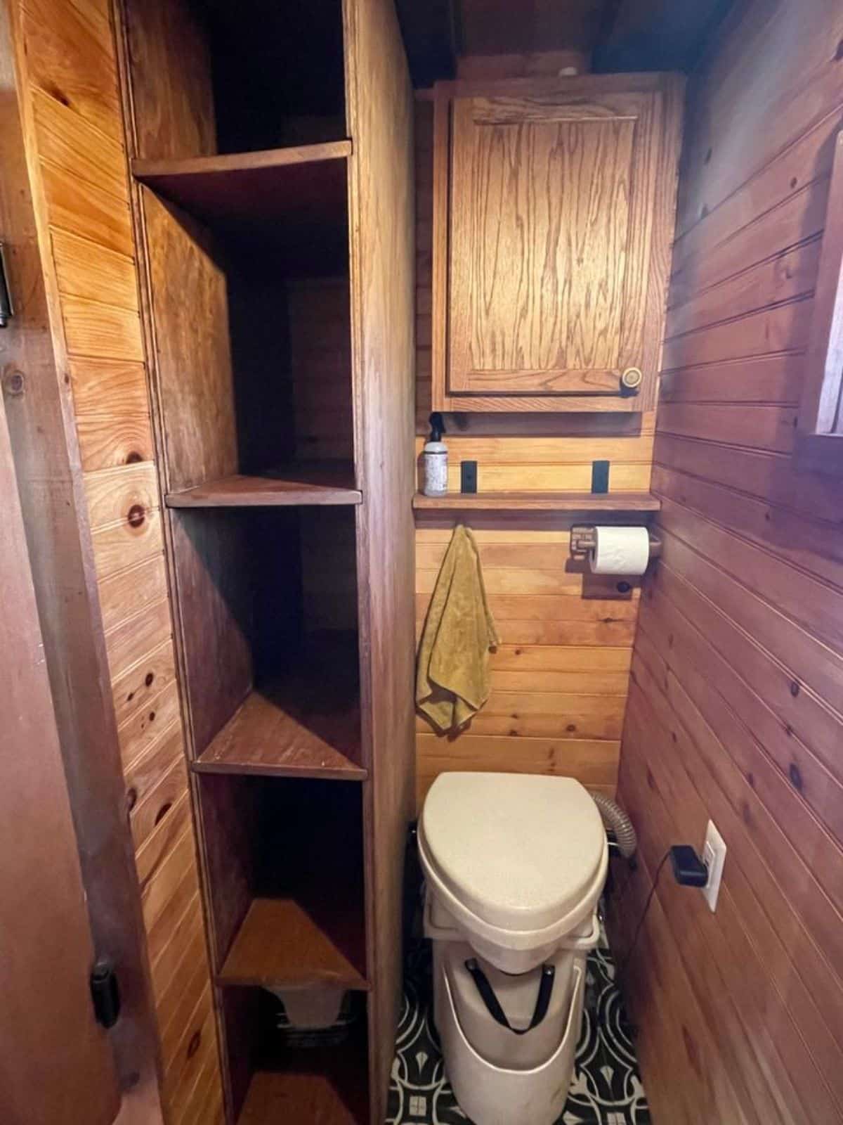 bathroom of custom tiny home has all the standard fittings
