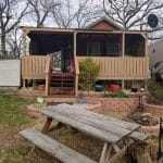 Featured Img of Lakefront Tiny Home Comes Partially Furnished, Is Parked in a Tiny Home Community!