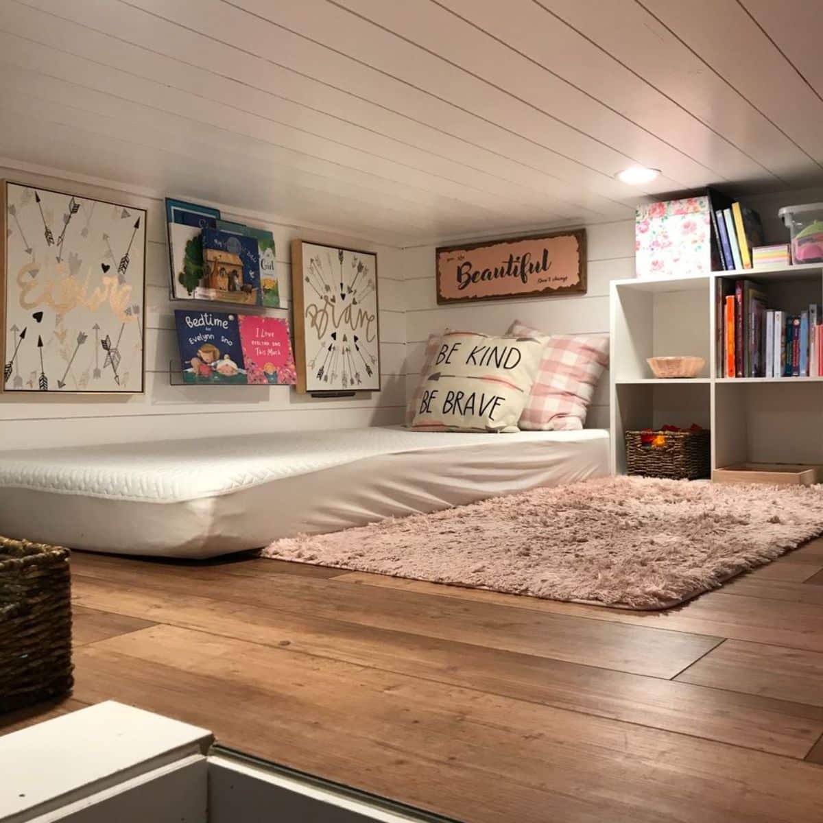 huge space left on the loft of fully furnished tiny home besides the mattress and storage cabinets