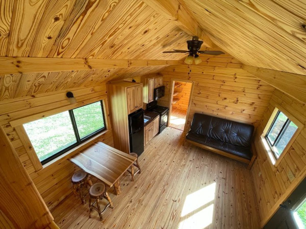 ariel view of wooden interiors of 2 bedroom tiny cabin