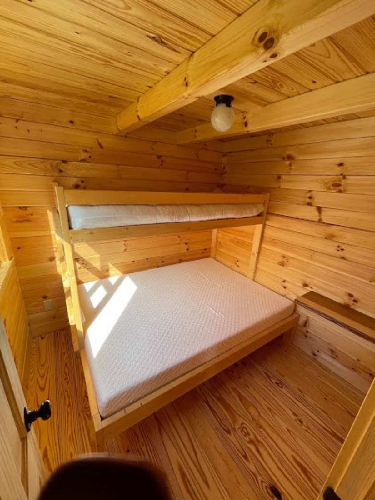 another bedroom has a bunk bed with ample space