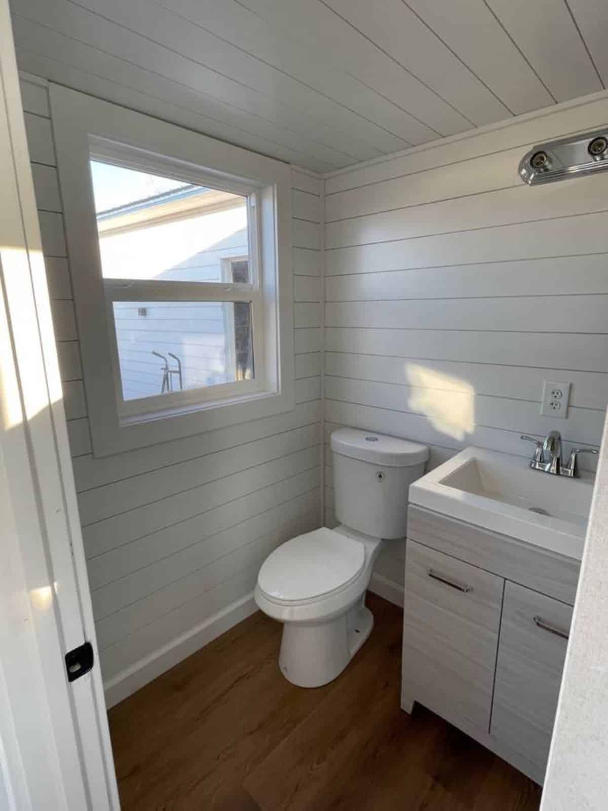 bathroom of micro home for four has all the standard fittings