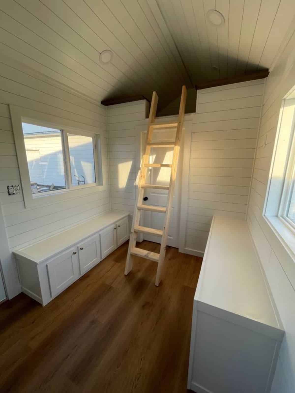 wooden interiors of micro home for four from kitchen view