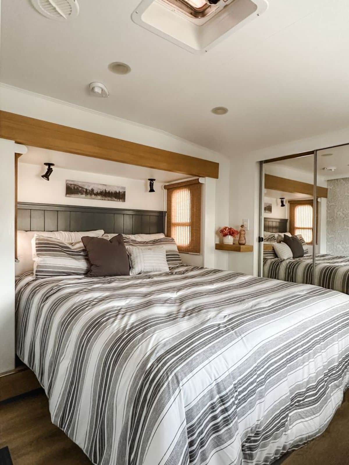 huge comfortable queen bed in bedroom of remodeled RV