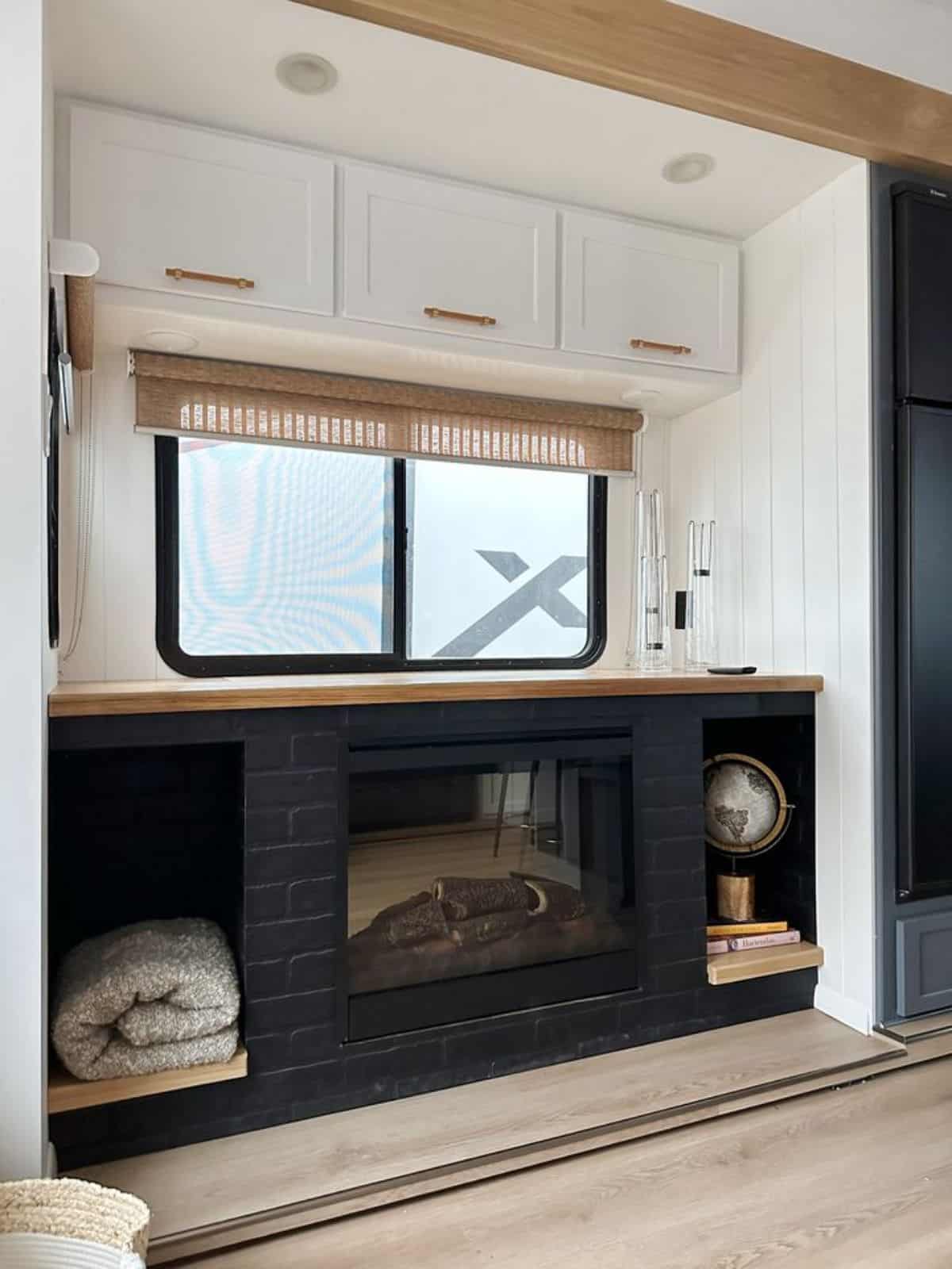 storage cabinets with fireplace in living area