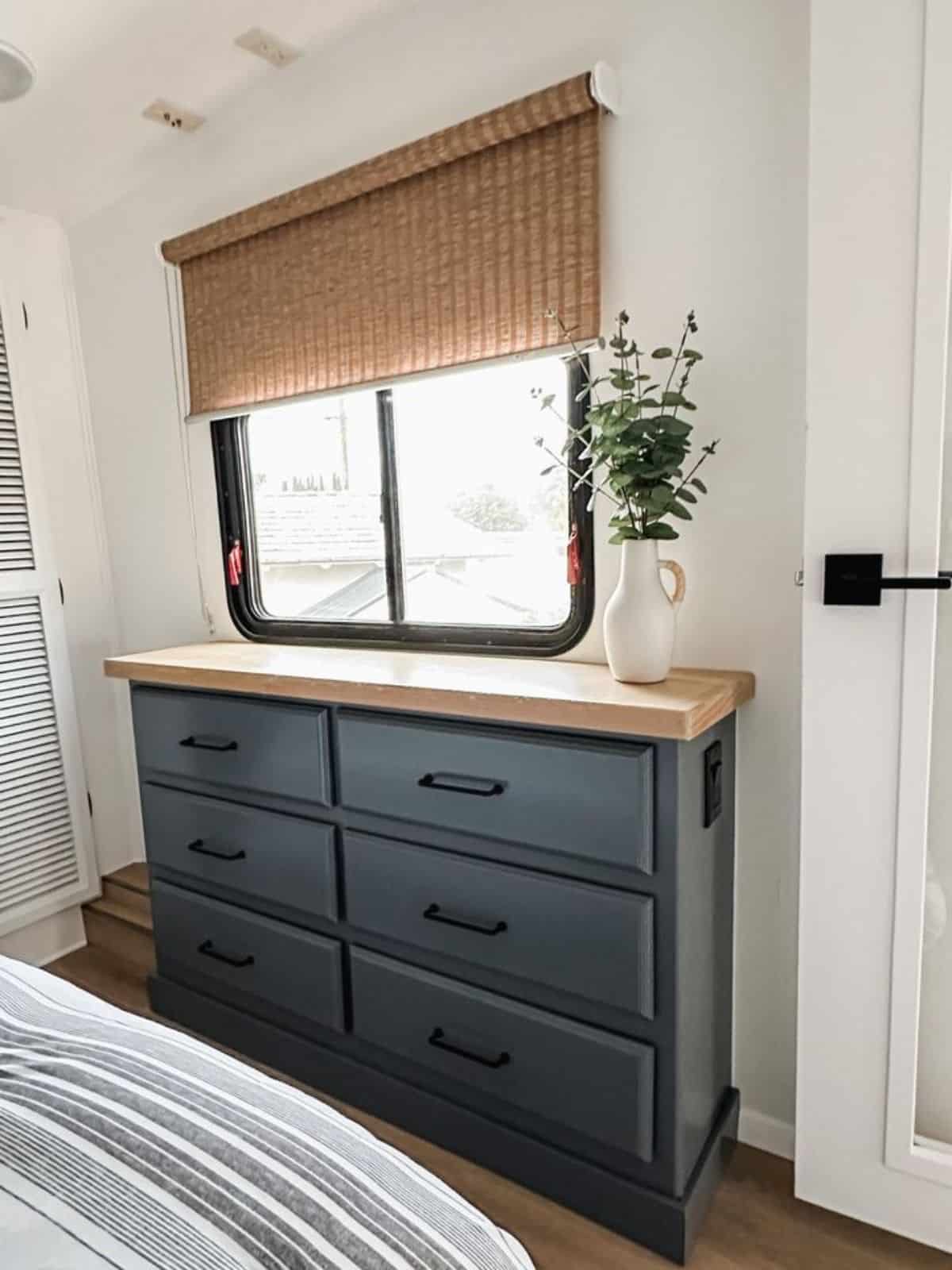 dresser with storage in bedroom of remodeled RV
