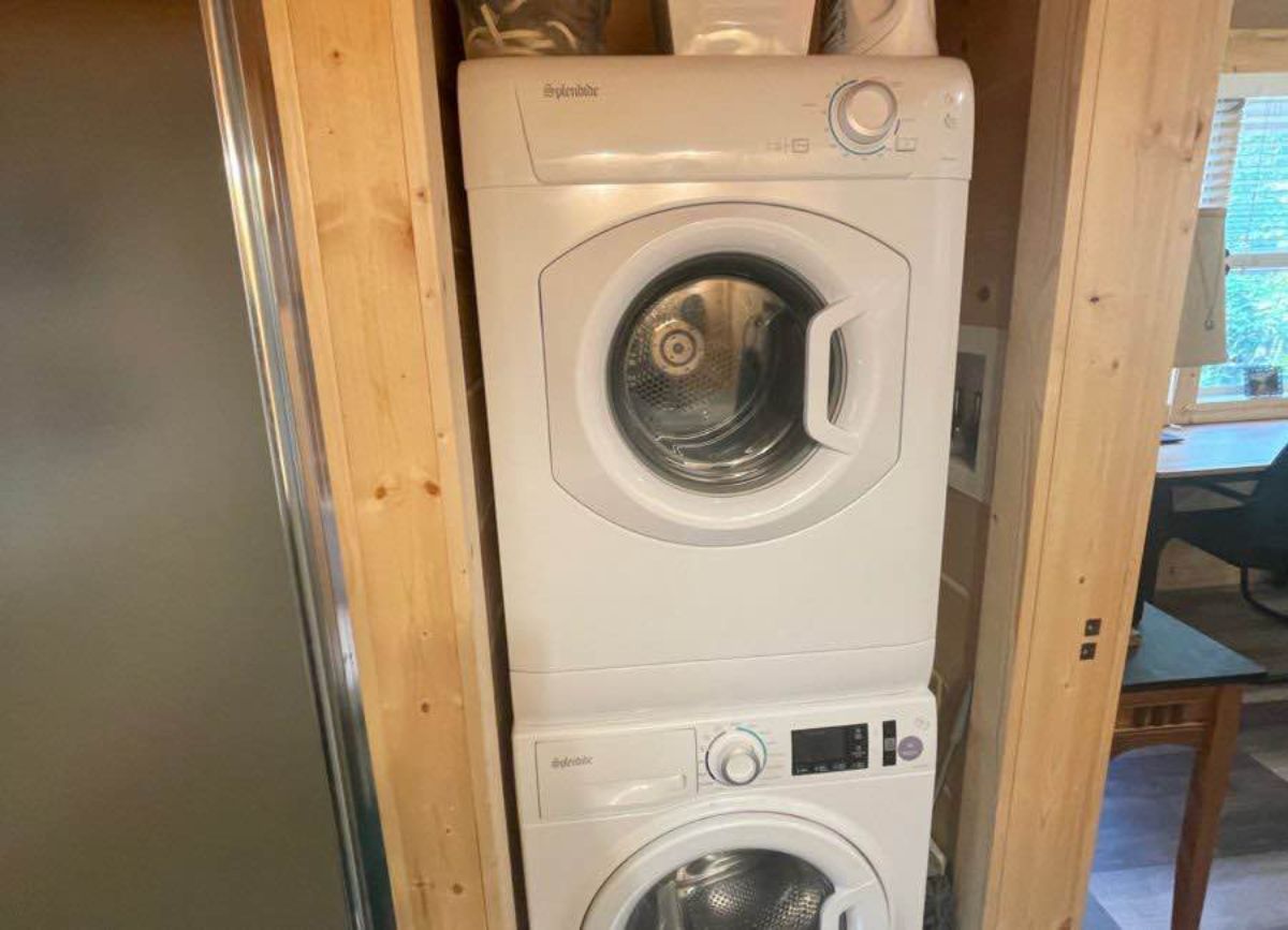 separate space for washer dryer combo of tiny cabin