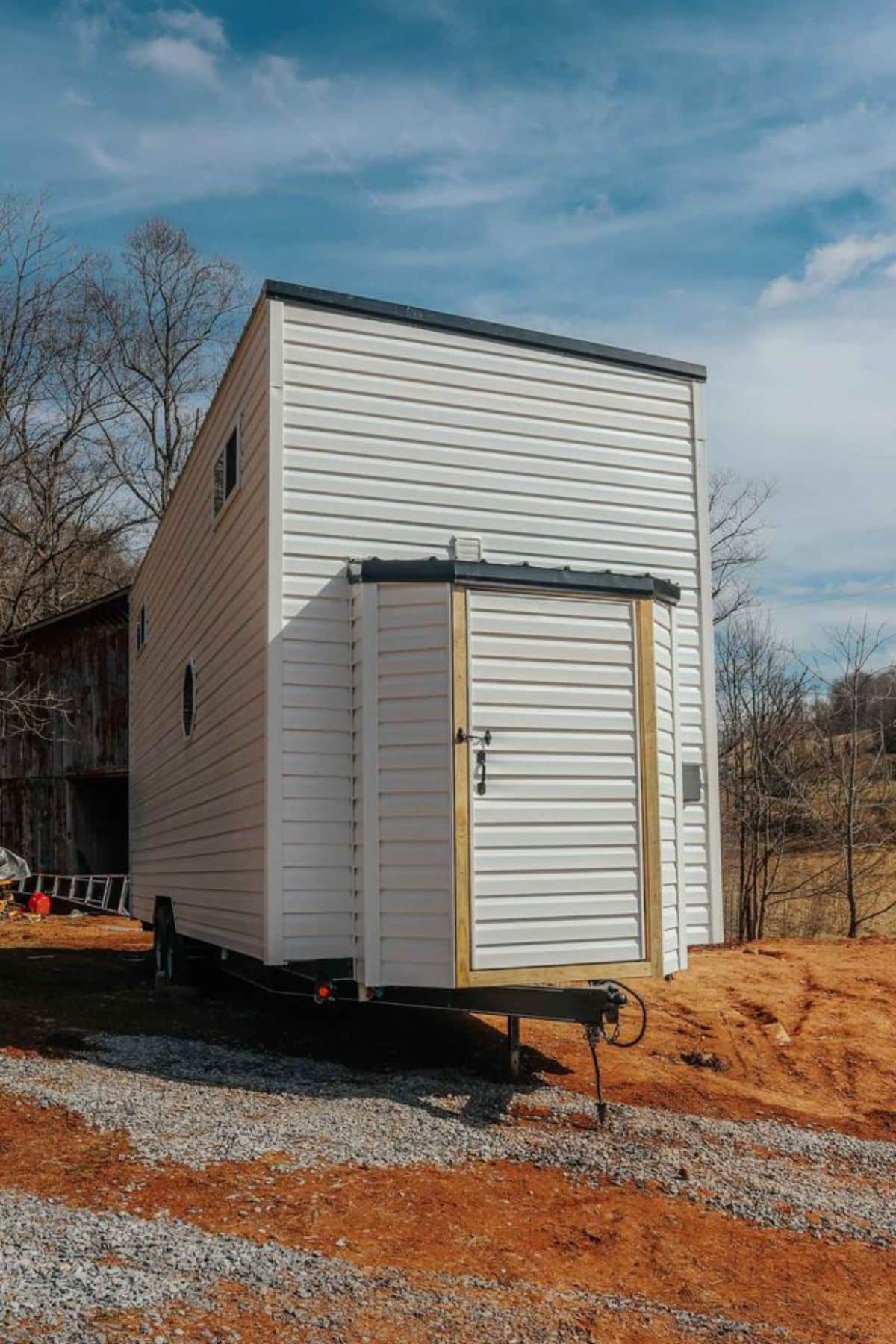backside of spacious tiny house on wheels from outside