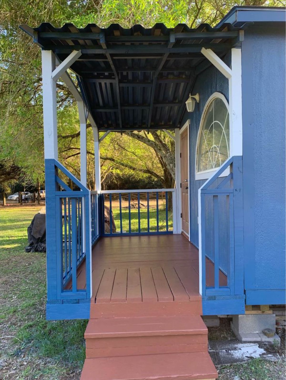 huge porch outside the main entrance of stunning 2 bedroom tiny home